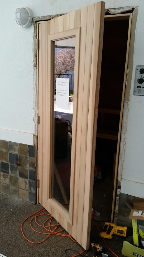 Exterior door replacement in progress with custom wood door, Portland OR